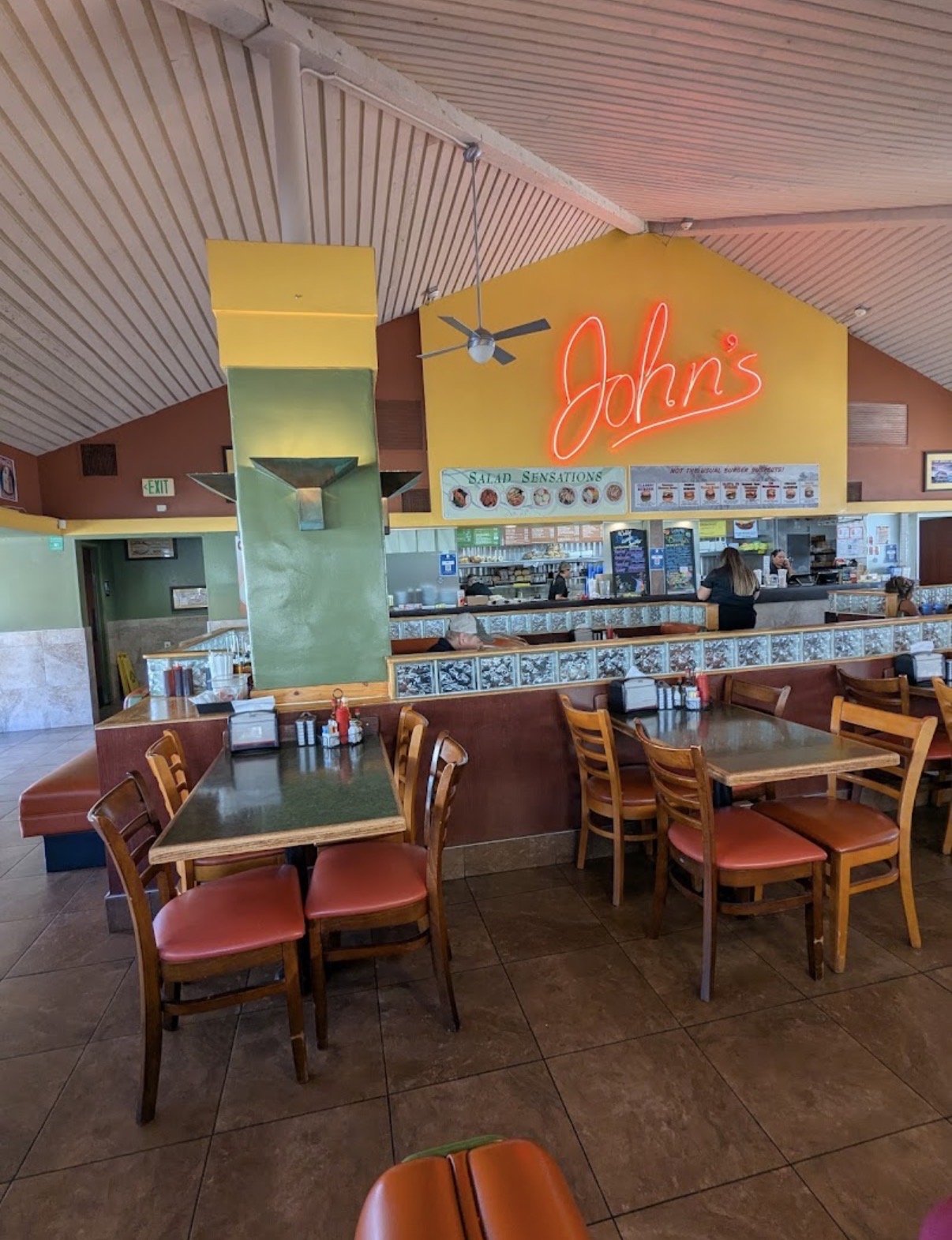 Interior of John's Restaurant in Palm Springs with its neon sign